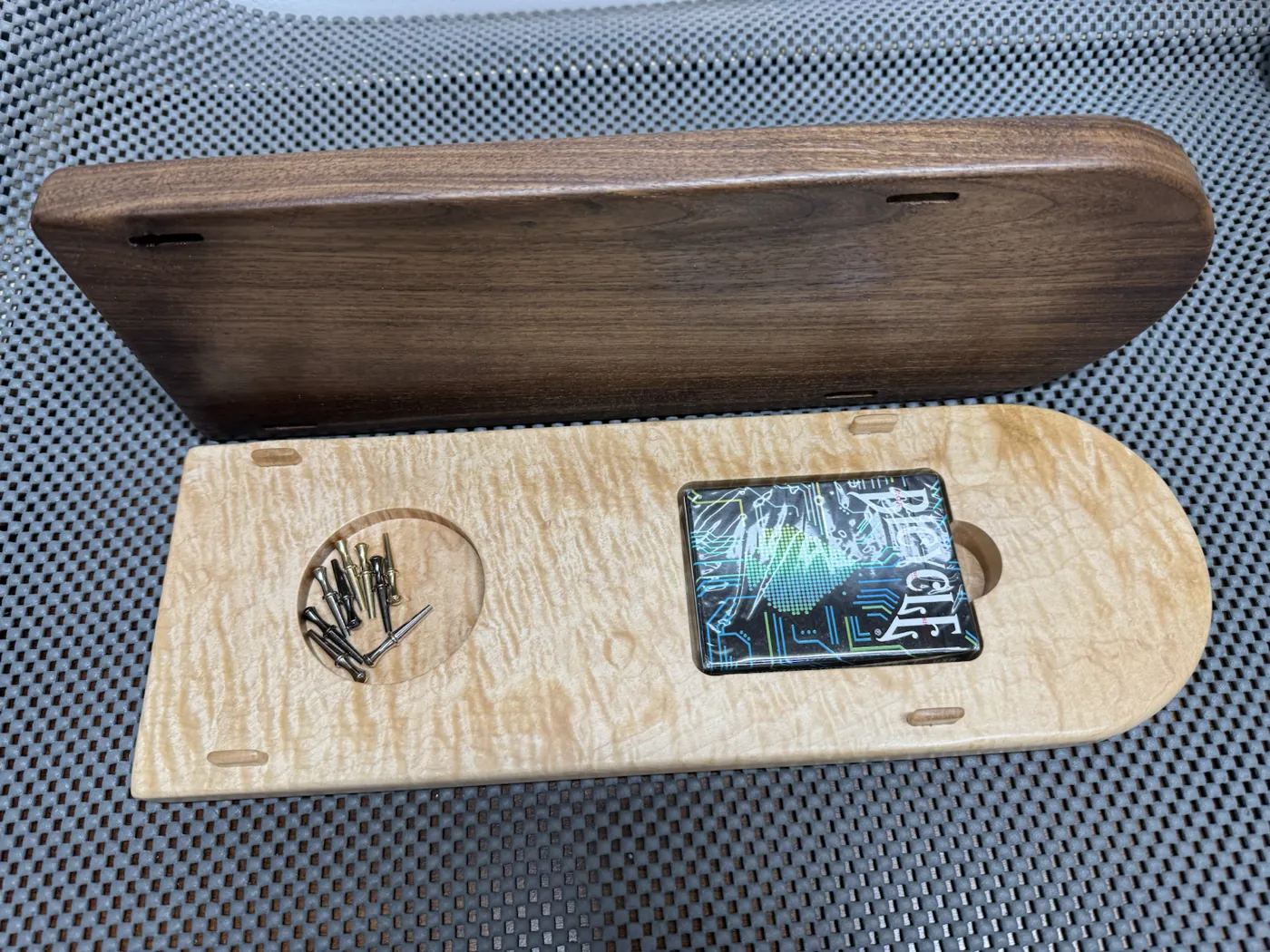 Open custom cribbage board showing built-in storage for playing cards and pegs