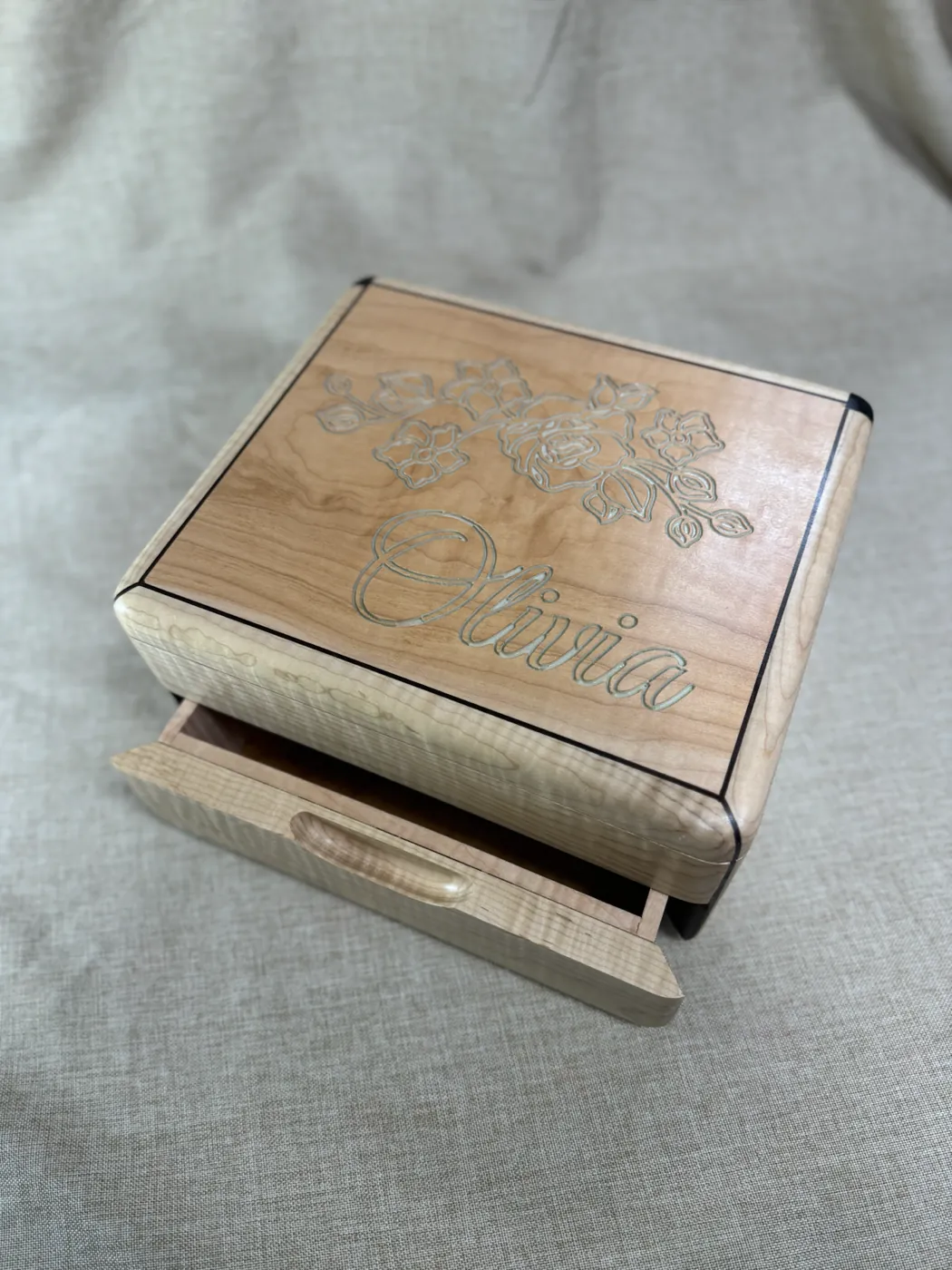 Personalized tiger maple box with walnut splines and an engraved wooden lid