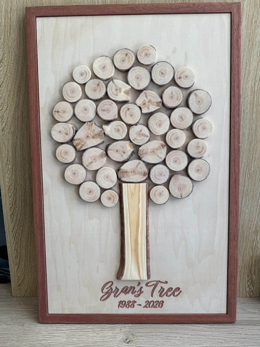 Memorial tree frame made from slices of a family's sentimental pine branch